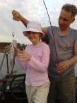 Любимая дочка поймала первую рыбу. справа не я - егерь Cерега